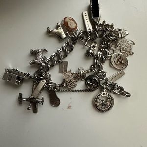 Sterling silver charm bracelet with 17 charms
